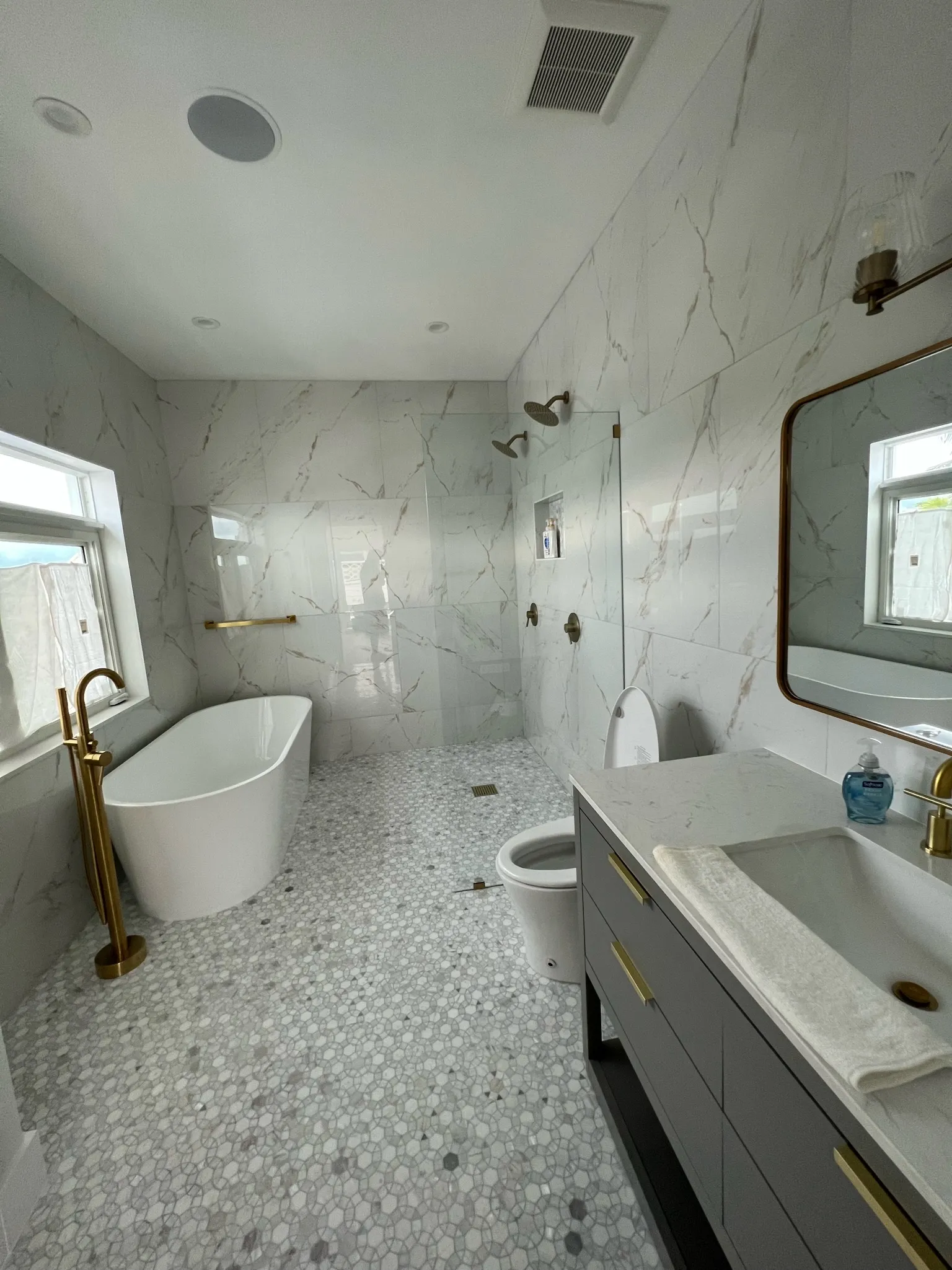 Primary bath — freestanding tub and marble walk-in shower